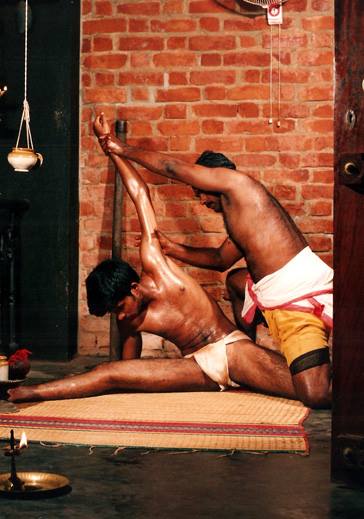 Marma therapy stretching and manipulation treatment demonstrating traditional Kerala healing techniques for flexibility and pain relief